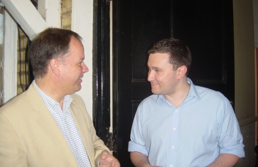 Michael talking with a Clapham resident during a campaign session 